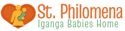 Logo for St. Philomena Iganga Babies Home with the text in orange and green. Nex to the logo is an abstract graphic that shows a silhouette of a woman holding a baby inside of a red heart.